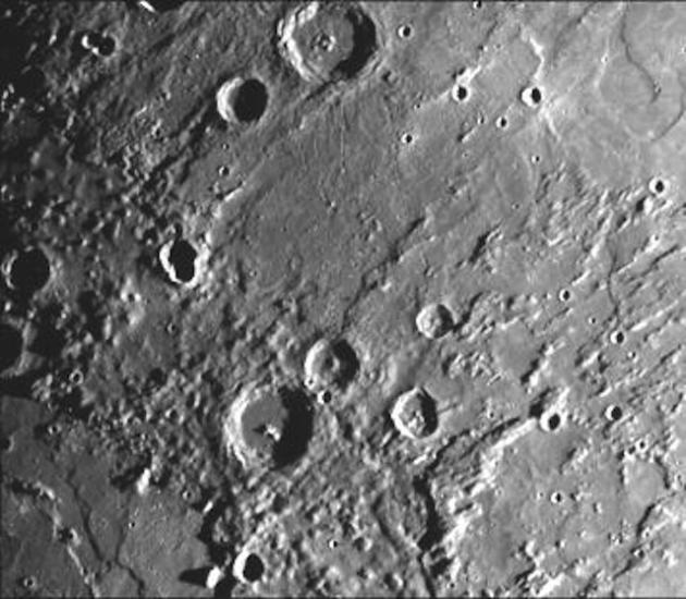 A section of Mercury with many craters on the surface.