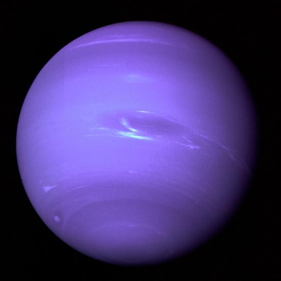 Full disk view of Neptune, a blue gas planet, with some lighter blue clouds visible.