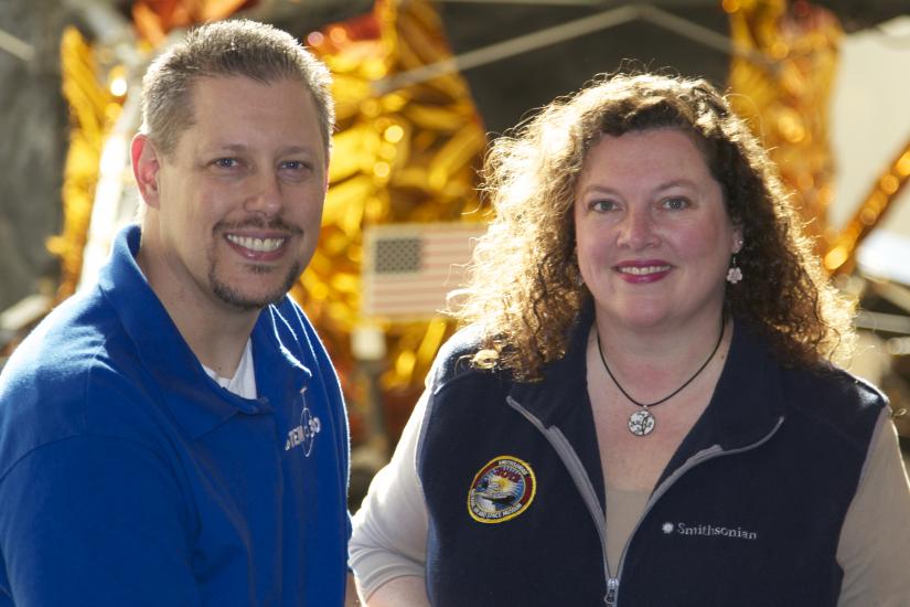 Marty Kelsey, a white man, and Beth Wilson, a white woman, stand together and pose formally.