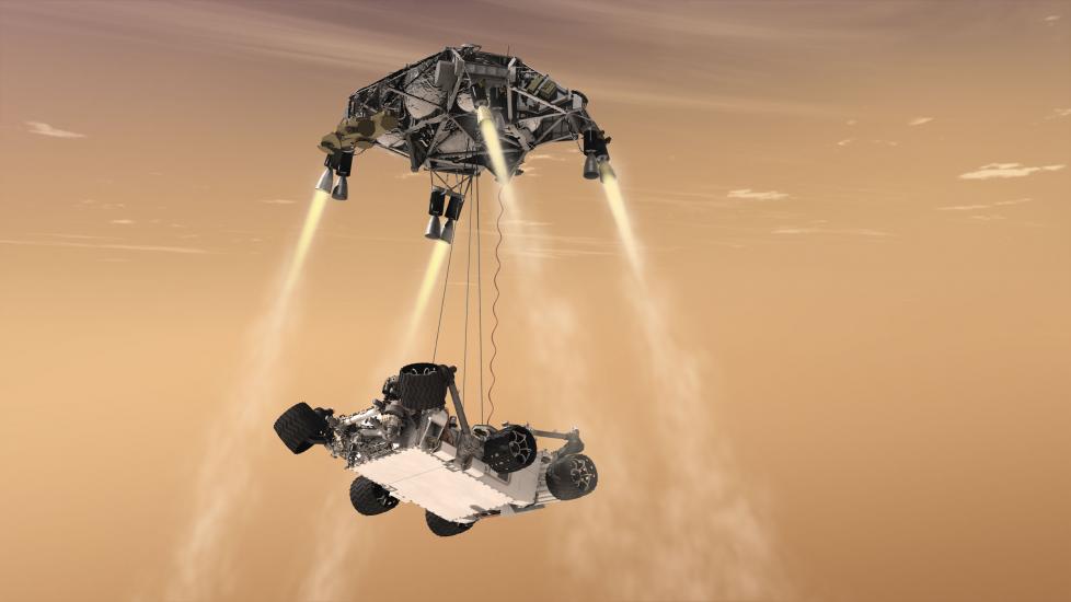 Artist depiction of Curiosity, a robotic Mars rover, in the process of landing on Mars using part of its body with propellors to facilitate a safe landing.