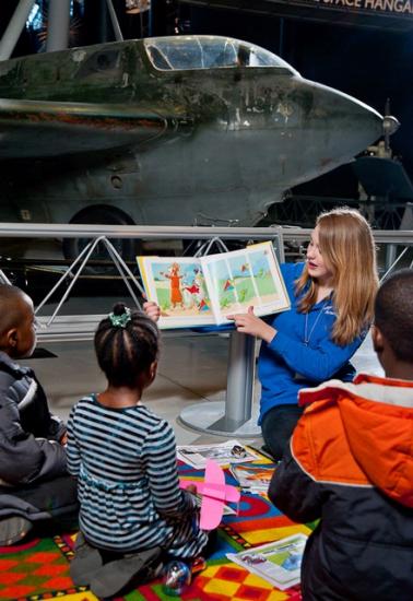 Children listen to a story read at the Udvar-Hazy Center.