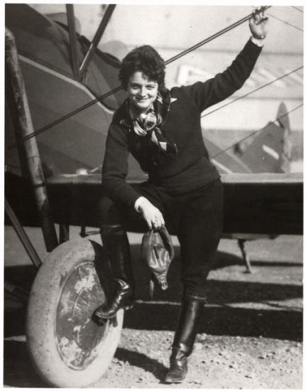 Black and white historic photo of female aviator