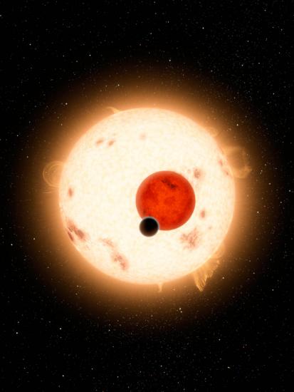 An illustration of a small planet in front of a smaller red dwarf star and a larger yellow star.