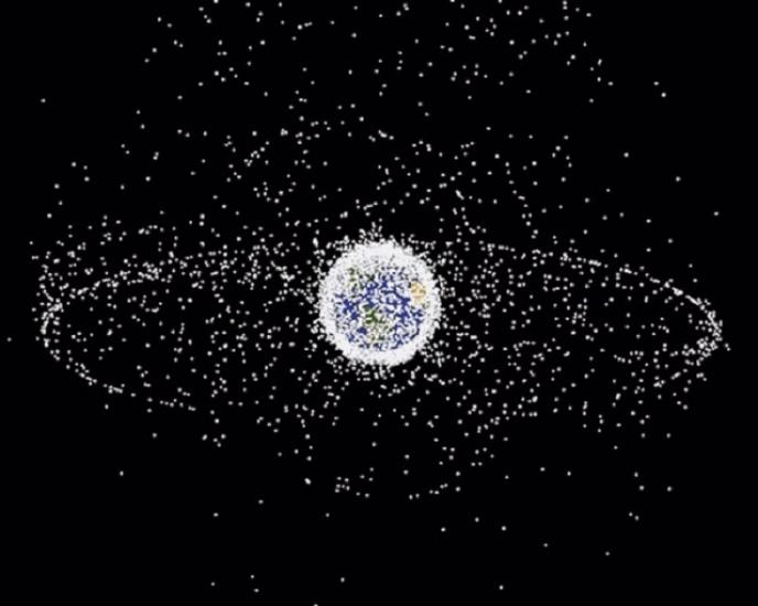 A view of the Earth in space and the orbiting objects around the Earth, which is illuminated as white dots.