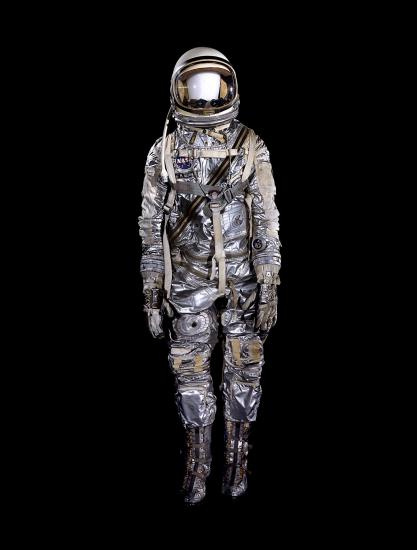 Spacesuit made of aluminized fabric with boots, gloves, and helmet on mannequin