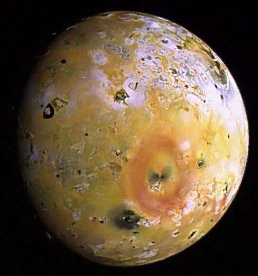 A partial view of Io, Jupiter's closest large moon, and its topography and view of some volcanoes.