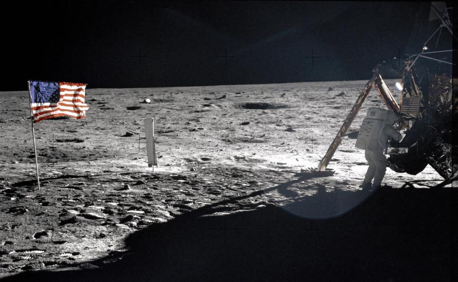 Image of Neil Armstrong at work near the lunar module Eagle.