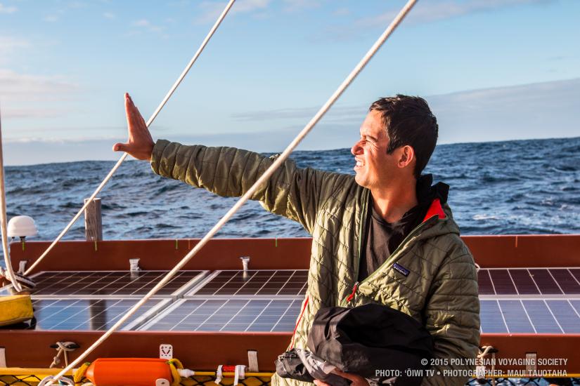 A person aboard a boat uses the position of the Sun to determine the direction of the boat's travel.