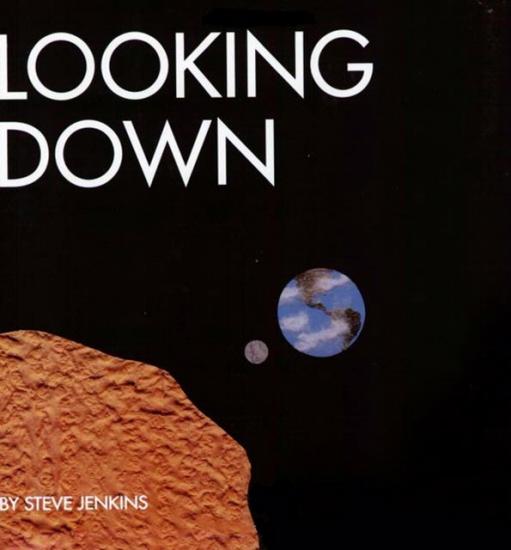 Portada de un libro sobre el espacio con una ilustración de la Tierra y la luna desde un punto de vista cercano a Marte y el texto “Looking Down” [“Con la mirada hacia abajo”]