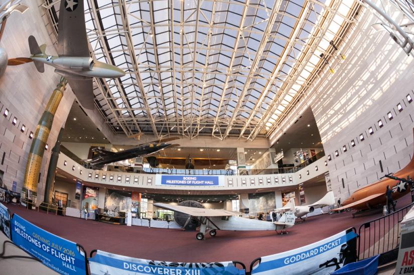 A fisheye style view of the Museum's Milestones of Flight Hall, with multiple aircraft on display. However, the aircraft are sparce as the Museum is in the process of performing renovation of the display.