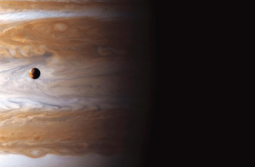 Io High Above Jupiter’s Storms