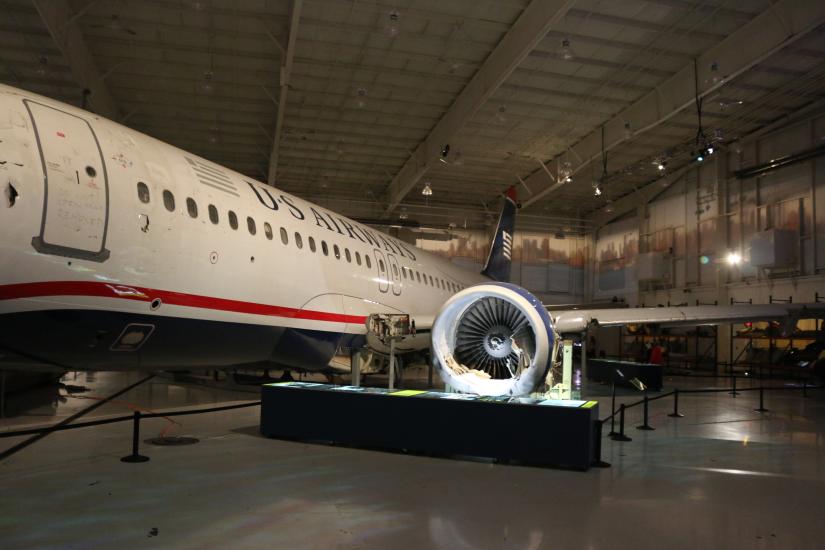 View of the side of the aircraft with an engine clearly visible. 