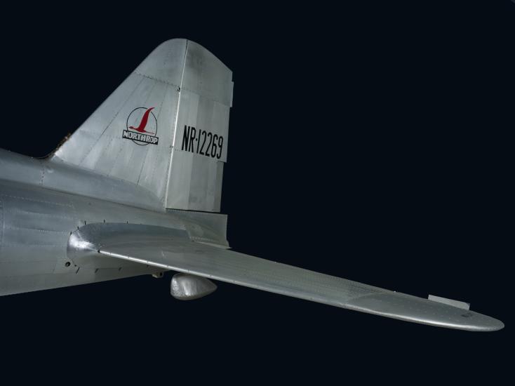 Tail of Northrop Gamma Polar Star aircraft with "Northrop" logo and "NR-12269" in black lettering