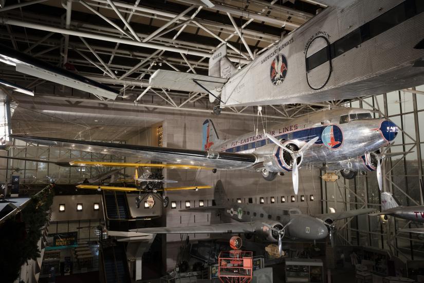 Twin-engined Douglas DC-3 aircraft hanging in museum