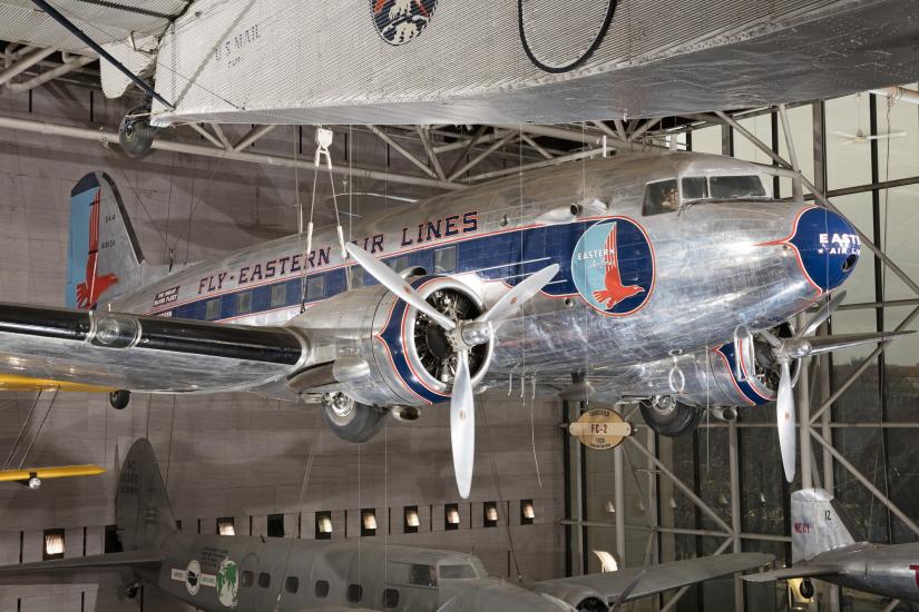 Twin-engined Douglas DC-3 aircraft hanging in museum