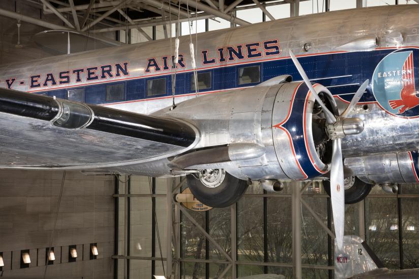 Side propeller and body of Douglas DC-3 aircraft hanging in museum