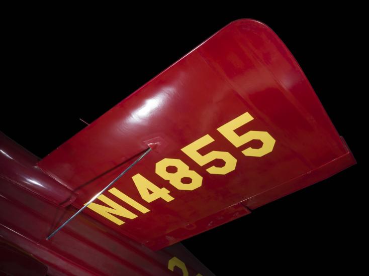 Wing of red Wittman Special 20 "Buster" aircraft with "NI4855" in yellow lettering