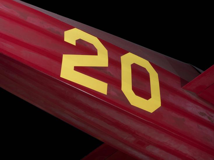 Yellow "20" on body of red Wittman Special 20 "Buster" aircraft