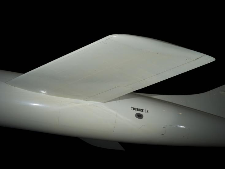 White flat wing of Douglas D-558-2 aircraft and "Turbone E.X." in black letters on body