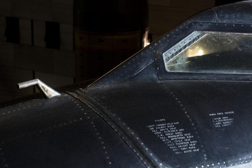 Small bent metal tue sticking out from cockpit of black titanium North American x-15 aircraft