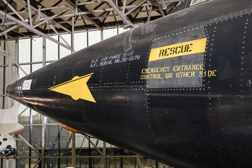 Yellow rescue label and yellow spear detail on nose of black titanium North American x-15 aircraft