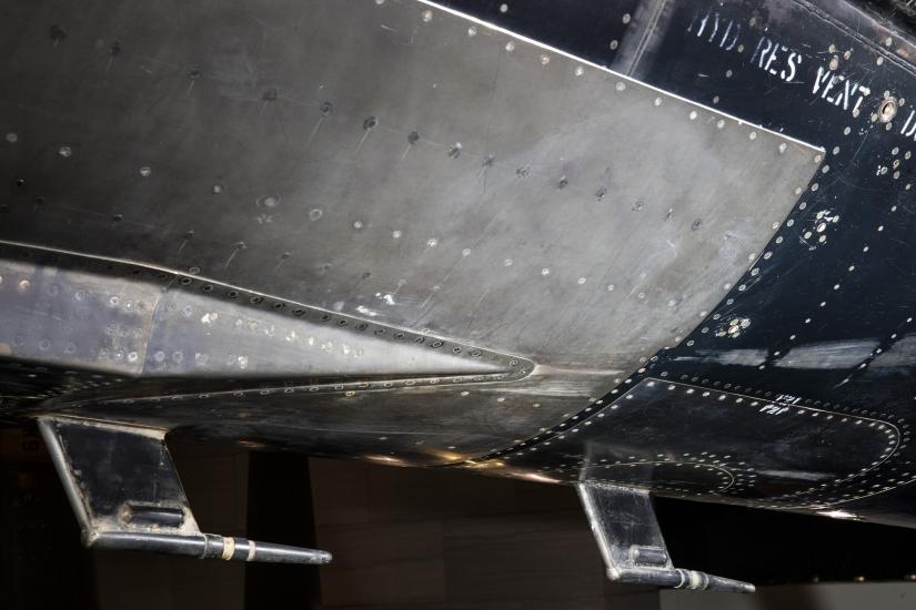 Metal plated vent on bottom of black titanium North American X-15 aircraft