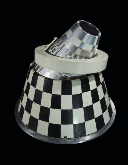 Infrared sensor with black and white checkered cone with a ring mount.