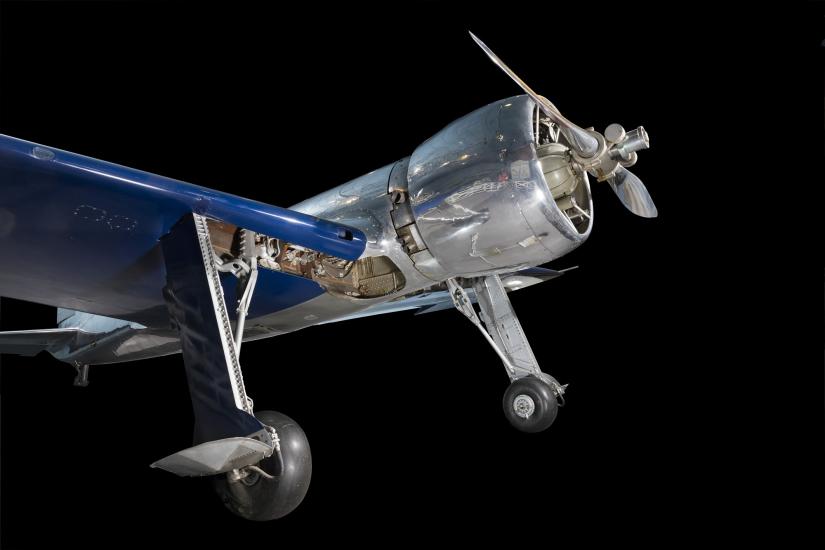 Front of metalic silver and blue Hughes H-1 Racer aircraft with propeller and engine