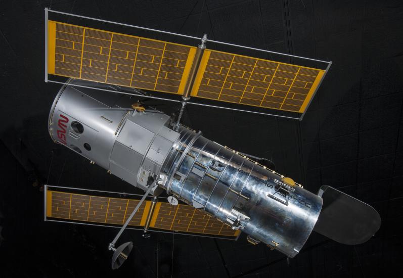 Side view of metal Hubble Space Telescope Model with yellow solar panels