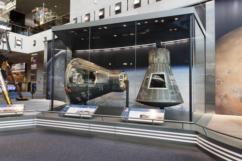 Mercury Friendship 7 and Gemini IV on display in the Boeing Milestones of Flight Hall