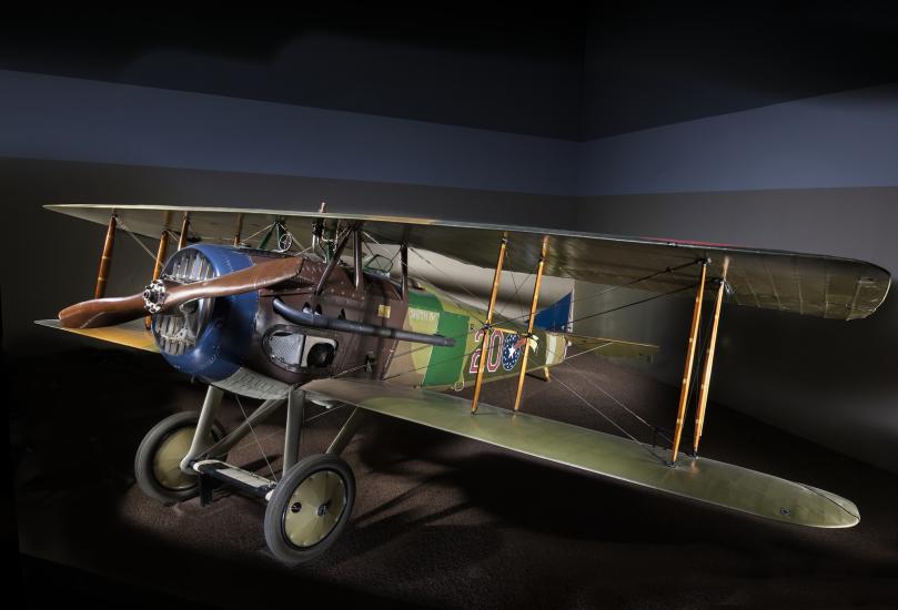 Green and brown Spad XIII "Smith IV" biplane in museum