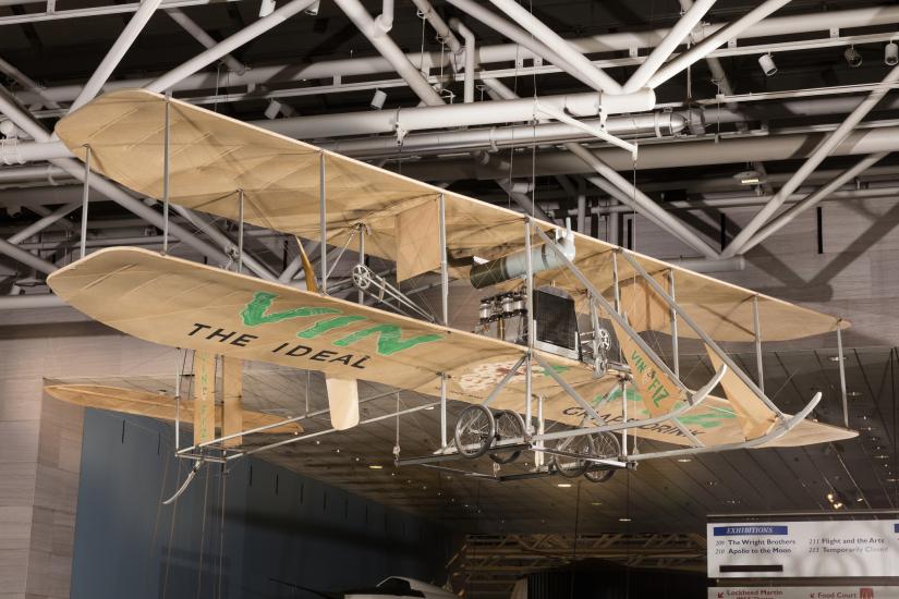 Wood and fabric Wright EX Vin Fiz biplane hanging in museum