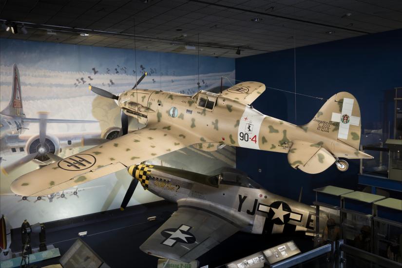 Side of tan Macchi C.202 Folgore aircraft hanging in museum