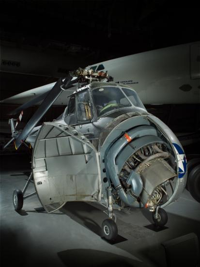 View of a helicopter with a half open nose.