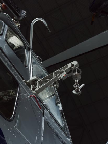 View of a cargo hook attached to a helicopter.