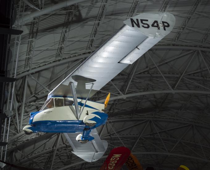 Painted blue and white roadable aircraft with a silver painted wing. 