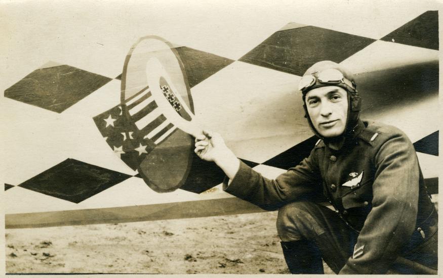 Palmer points to his insignia of a hat inside a ring. 