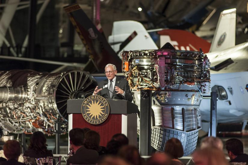 Gen. J. R. "Jack" Dailey, a white male who was formerly Director of the Museum, speaks to guests during an anniversary celebration of the Museum's Steven F. Udvar-Hazy Center.