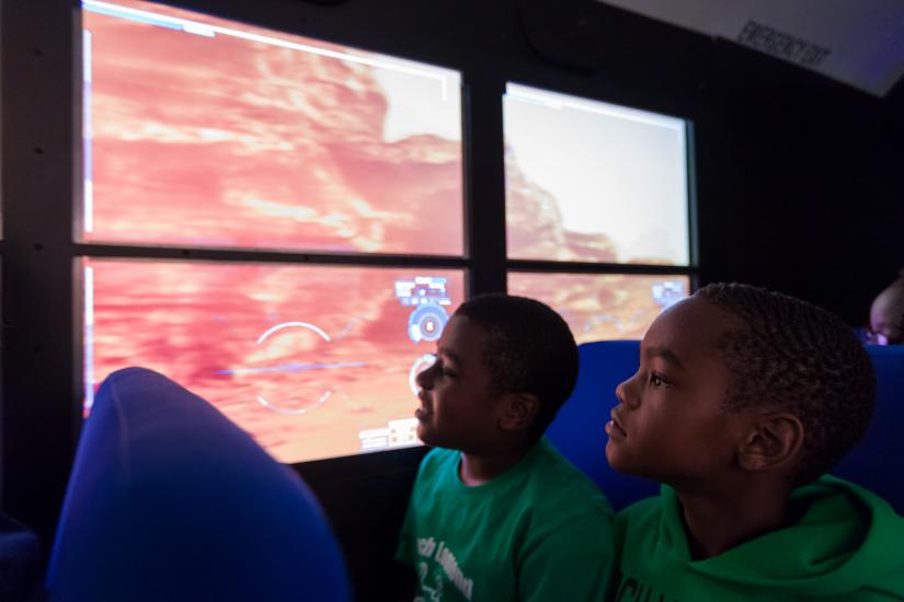 Two students on Mars Experience Bus