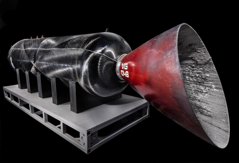 Red and black hybrid rocket engine with "VG 048" lettering in white