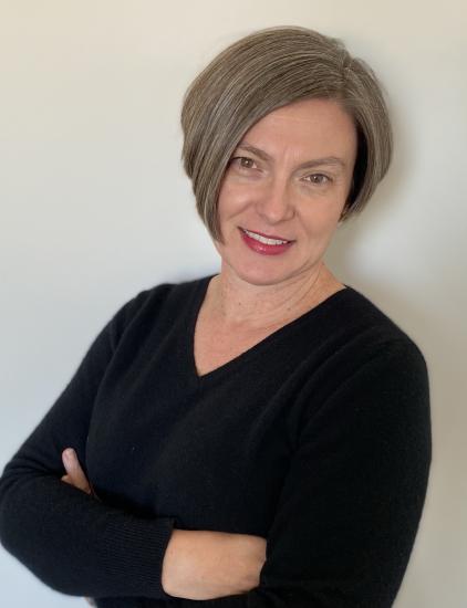 A headshot of a woman. 