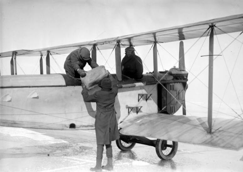 A photo of alcohol being unloaded from an airplane.