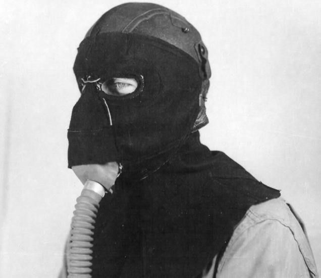 Member of the 390th Bomb Group, modeling a frostbite mask