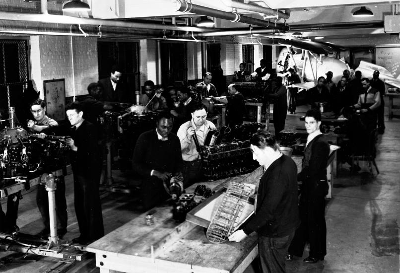 Group of Men Working on Engines