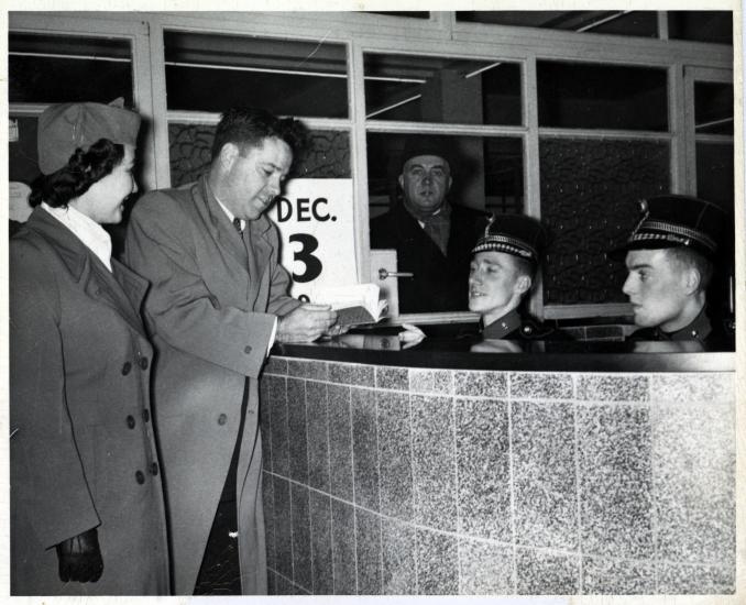 Lanphier presents his passport in Belgium