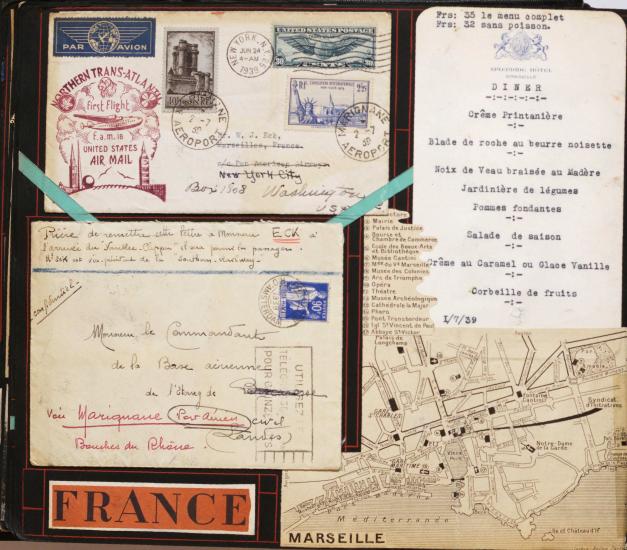 Scrapbook page with two envelopes, a menu, and a map of Marseilles