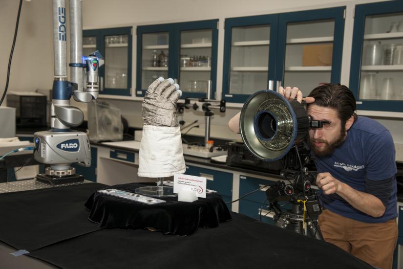 Armstrong glove on a stand while being 3D scanned.