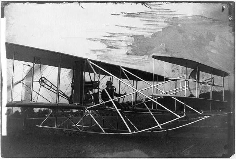 Orville Wright getting ready to fly