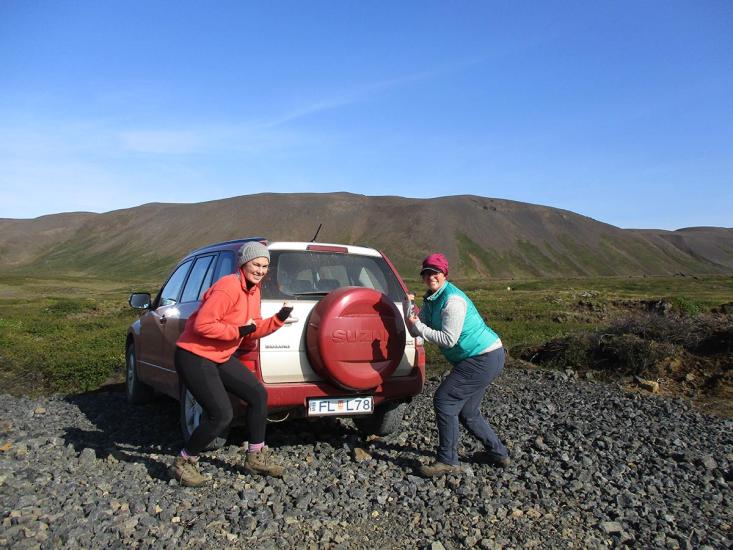 CEPS scientists next to their field vehicle.