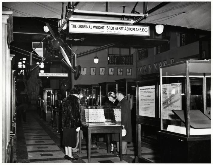 Visitors look at exhibit